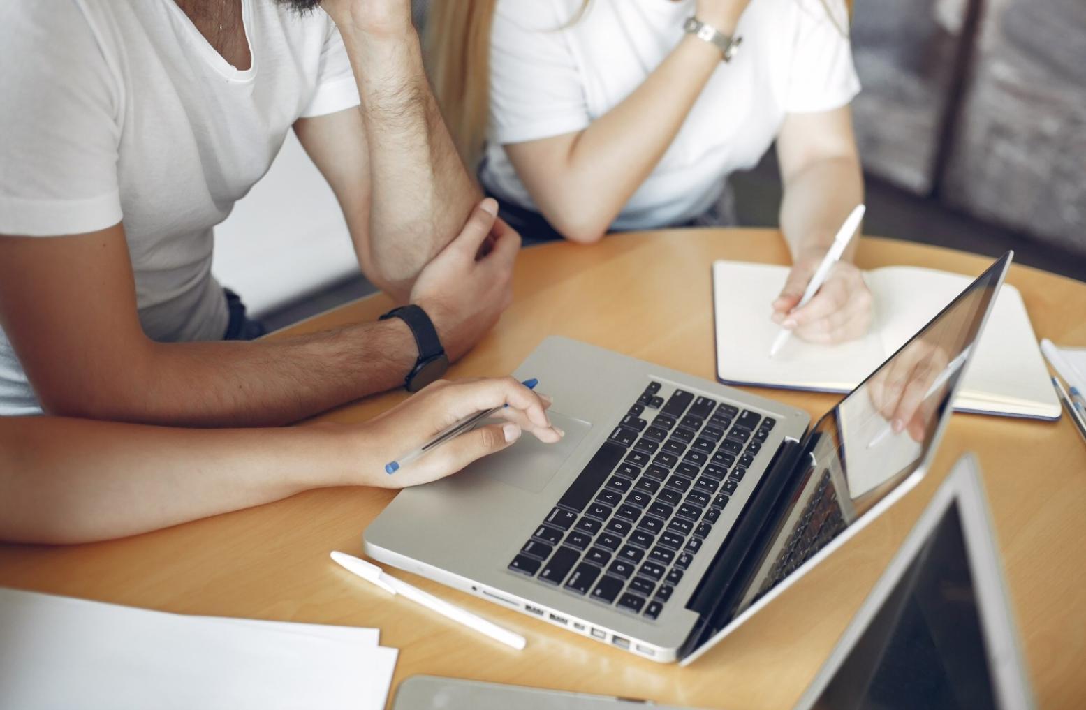 Strategic planning session with financial charts and business analysis materials